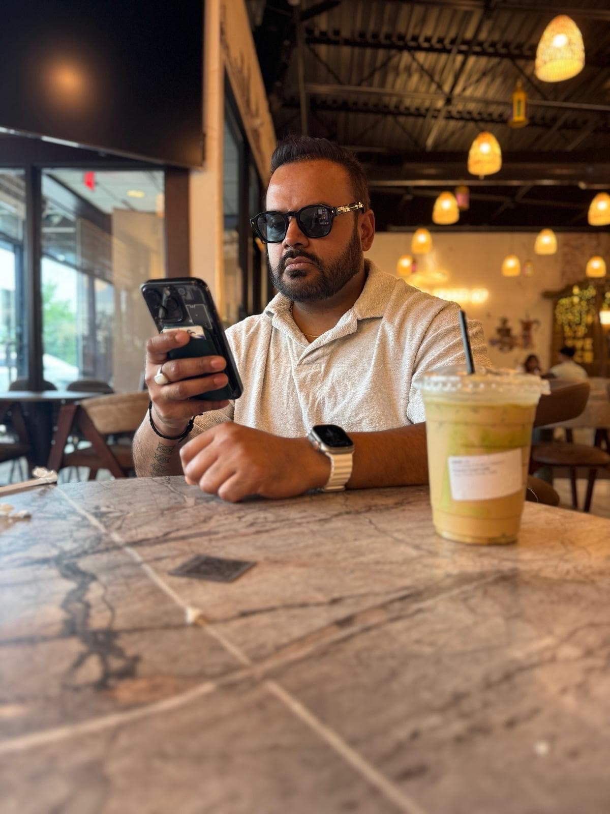Varun chatting with a client over coffee